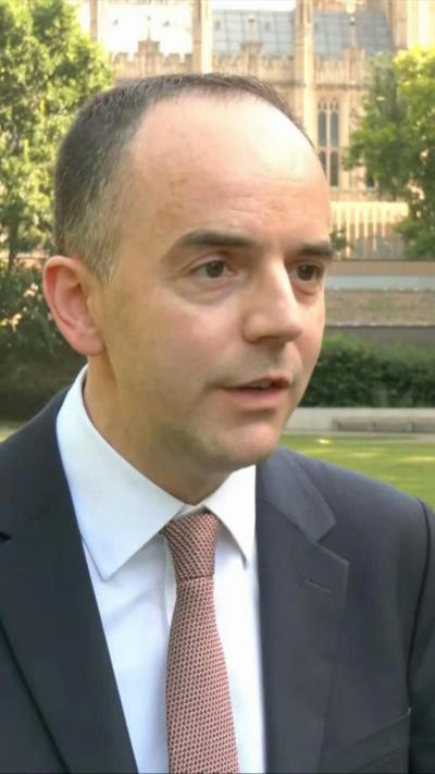 James Murray speaking outside parliament