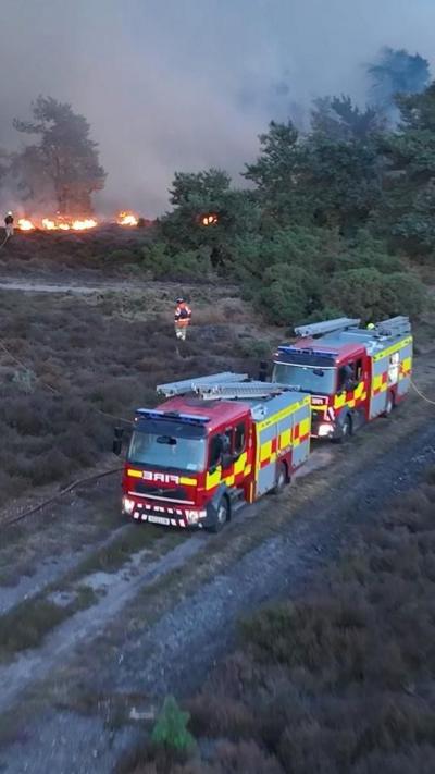 Two fire engines near a fire