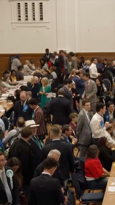 A group of people counting election votes