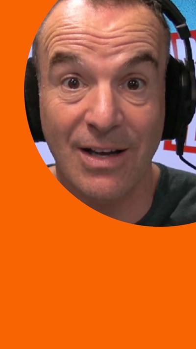 Martin Lewis wearing a headset looking at the camera
