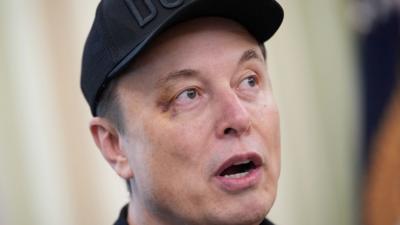 Elon Musk speaks alongside U.S. President Donald Trump to reporters in the Oval Office of the White House
