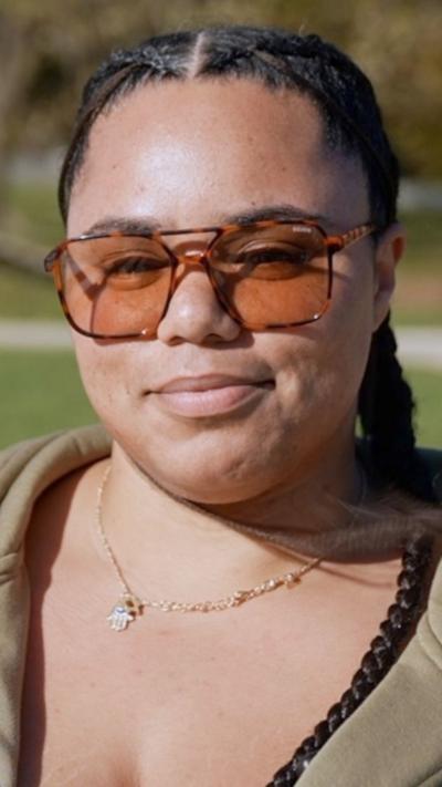 Woman wearing braids and sunglasses
