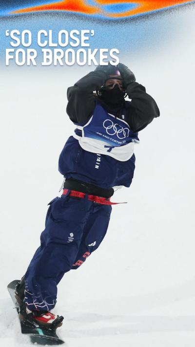 Mia Brookes holds her hands to her head as she finishes snowboard big air event
