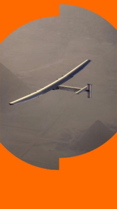 Image of a small aircraft flying over pyramids.