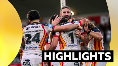 Catalans celebrate Charlie Staines' try against Bradford.