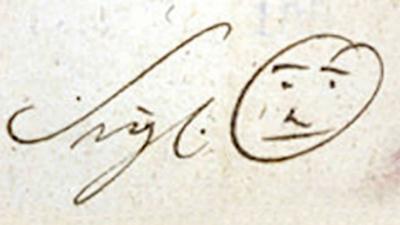 Photograph of writing followed by a smiley face