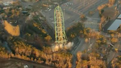 Aerial view of Kingda Ka with smoke clouds coming from its base.