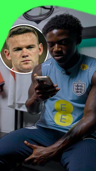 Kobbie Mainoo reading a text message from Wayne Rooney