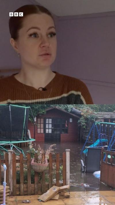 Split screen view with a woman at the top with red hair and red and blue jumper. Below is a garden scene with a flooded garden.