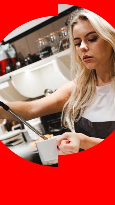 A young woman making a coffee