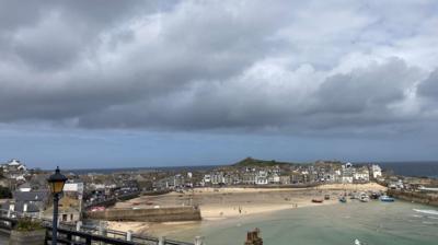 Shower clouds over a coastal village 
