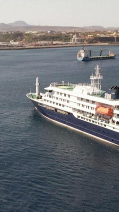 A cruise ship floats in the waters off the coast of Cape Verde.