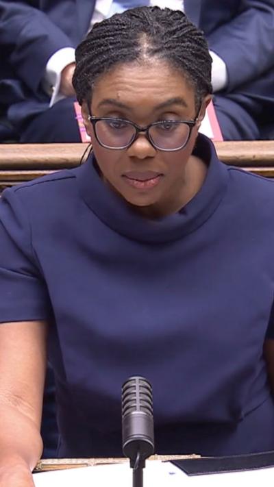Leader of the opposition, Kemi Badenoch, wearing navy top and speaking in the House of Commons 