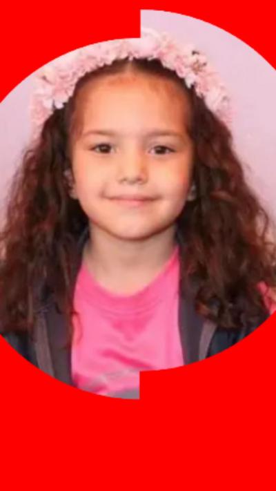 Five-year-old Hind Rajab has long, wavy brown hair. She is wearing a pink t-shirt and a headband that looks like a pink flower crown.