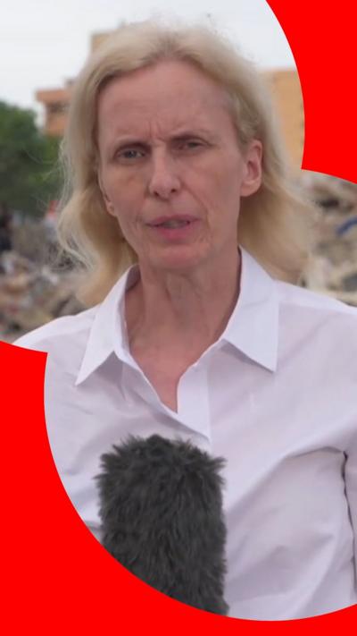 Orla Guerin has wavy blonde hair and is waring a white shirt.