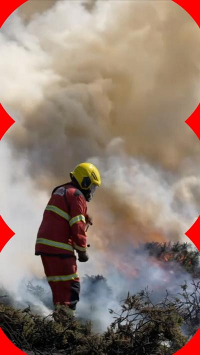 A firefighter surrounded by smoke