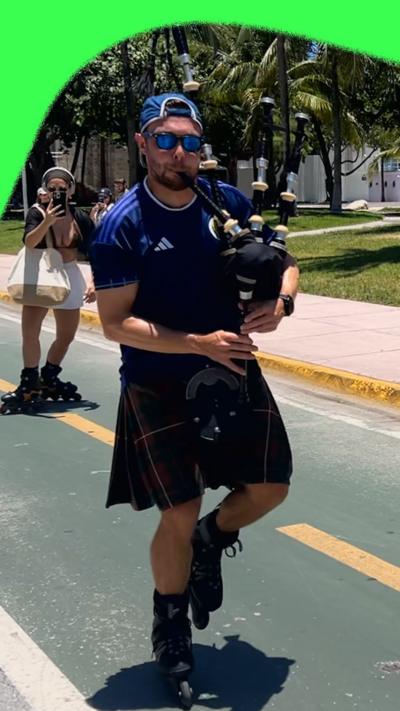A bagpiper on rollerblades
