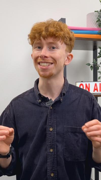 A ginger man in a blue shirt