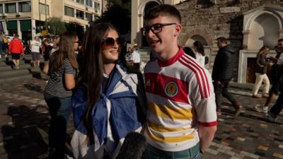 Two young Scotland fans speak in Greece