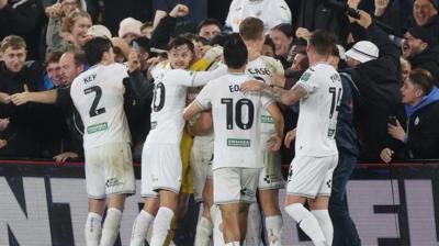 Swansea City players celebrate EFL Cup success over Nottingham Forest