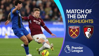 Marcos Senesi and Jarrod Bowen both go for the ball