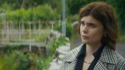 Death Valley character, DS Janie Mallowan, stands in a garden looking confused