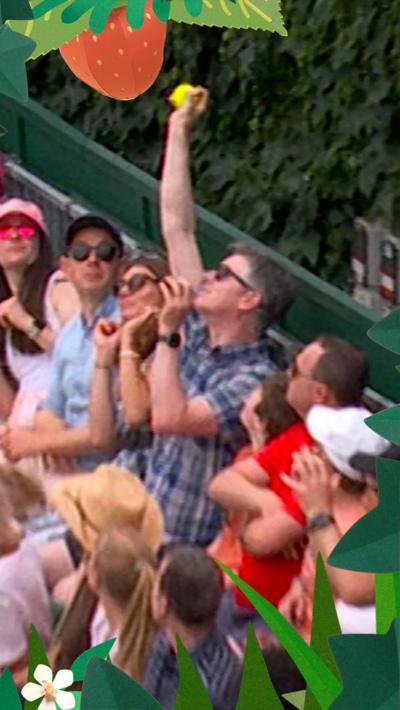 Crowd catching tennis ball