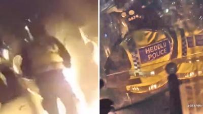 Flames erupt after petrol bomb explodes on impact in front of riot police