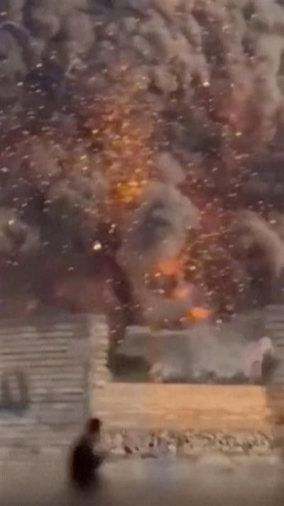 Large plumes of smoke and embers