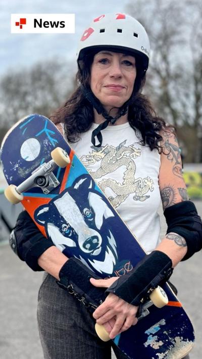 Jules Kurzeja, 64, hold her skateboard in at a skate park in Clapham.