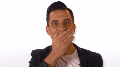 Comedian Russell Kane covers his mouth