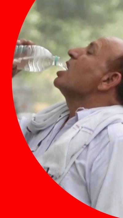Man drinking from a bottle of water