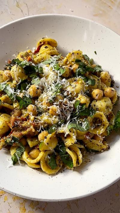A plate of creamy pesto chickpea pasta.