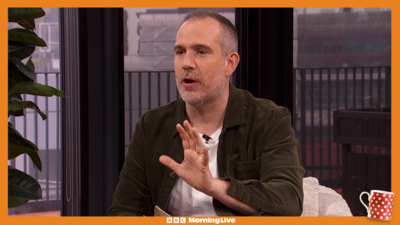 Dr Xand holds his hand up to make a point about melatonin in the Morning Live studio.