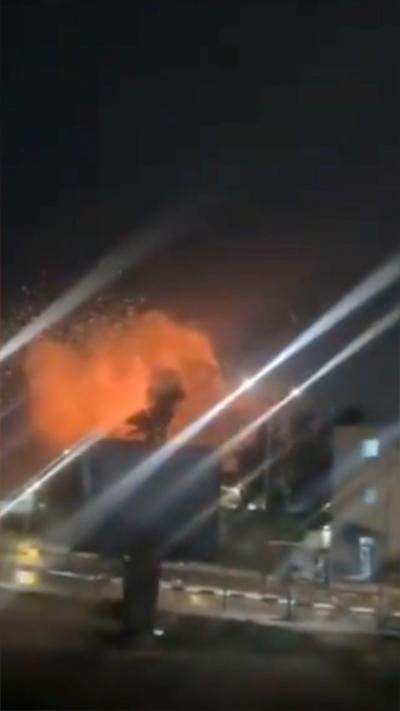A large firey cloud rising on a skyline