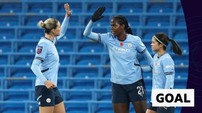 Khadija Shaw of Manchester City (C) celebrates scoring her team's second goal with teammates Alanna Kennedy (L) and Yui Hasegawa