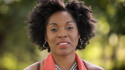 Profile image of woman looking at the camera