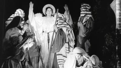 People on stage dressed as various figures from the nativity story.