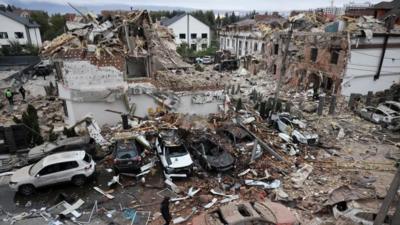 Destroyed neighbourhood and cars in Kyiv