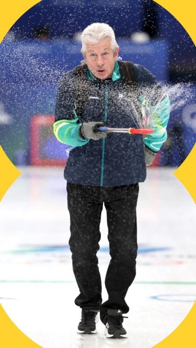 Mark Callan sprays water on a curling rink at the Winter Olympics.