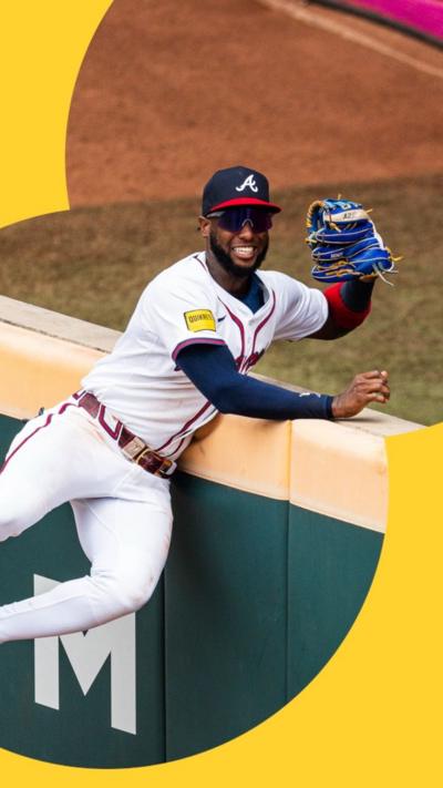 Smiling baseball player with caught ball in hand