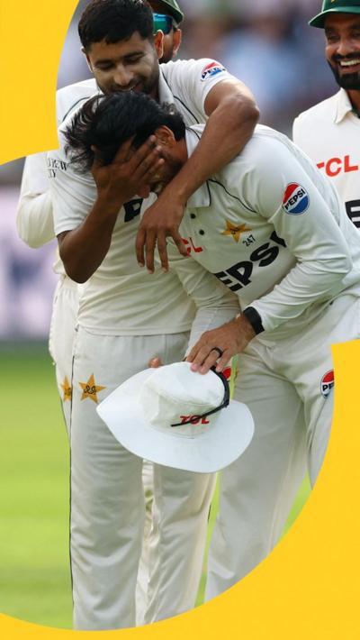 Khurram Shahzad is mobbed by his teammates as they celebrate his catch