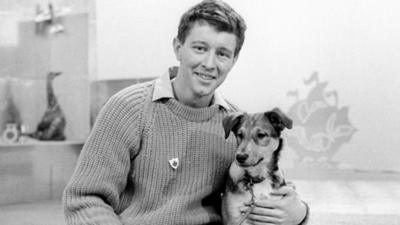 John Noakes with a dog in the Blue Peter studio