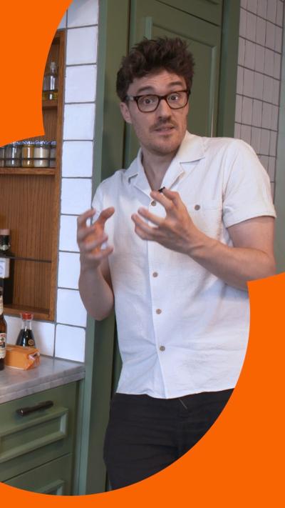 Man wearing a white shirt in a kitchen