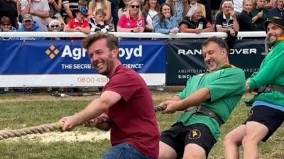 James Williams playing tug of war