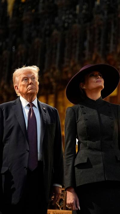 Trump and his wife looking up inside the chapel