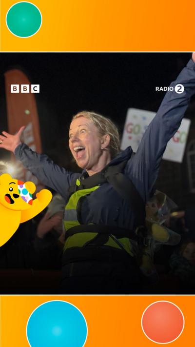 Sara Cox with arms in the air