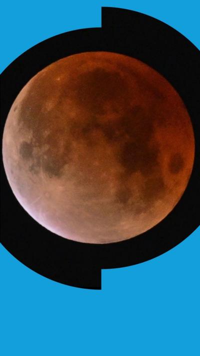 Red-coloured full Moon in night sky