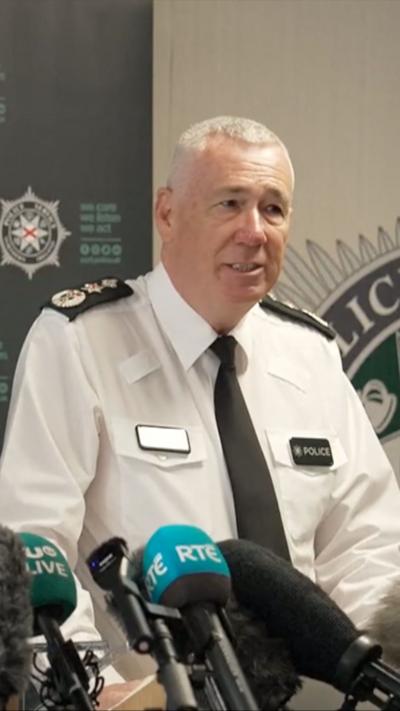 Northern Ireland police constable Jon Boutcher in uniform giving a press conference