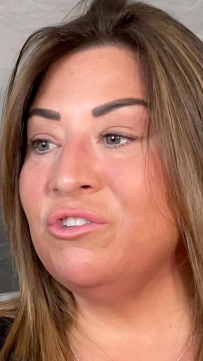 A woman filmed talking about PMDD 